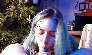 nice asian girl eats cum below the Christmas tree new year 2023
