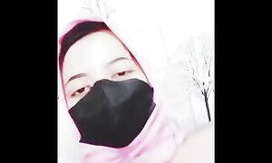 hijab woman playing approximately dildo respecting region